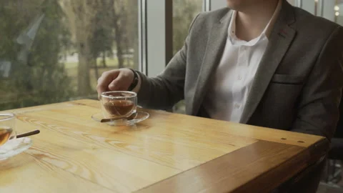 A man in a cafe drinking green tea Stock Footage 104370023