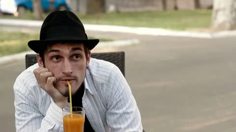 Man in a cafe drinking juice Stock Footage 11061702