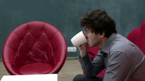 Man in a cafe drinks tea Stock Footage 71070442