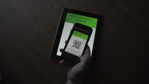 Man in a cafe registers for a visit using a QR code. STOP Covid-19 Coronavirus Stock Footage 156252962