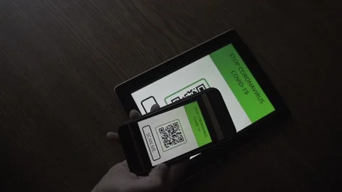 Man in a cafe registers for a visit using a QR code. STOP Covid-19 Coronavirus Video stock 156305710