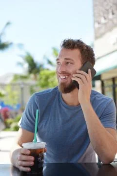 Man on cafe using smartphone talking on cell phone Stock Photos