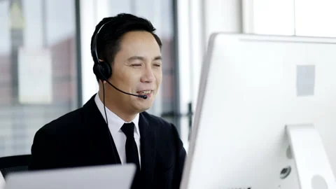 Man call center operator wear headphones talk information service customers Stock Footage 155802025