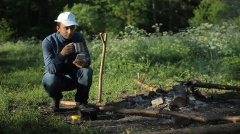 Man call by smartphone in camping Stock Footage 64057779