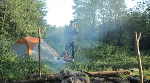 Man call by smartphone in camping Stock Footage 64057864