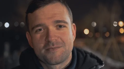 Man calling and talking on smart phone with mimic emotions smiling and sad at ni Stock Footage 102424615