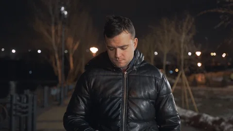 Man calling and talking on smart phone with mimic emotions smiling and sad at ni Stock Footage 102424810