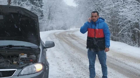 Man calling car assistance services because his car is broken. Concept road Video stock 147409012