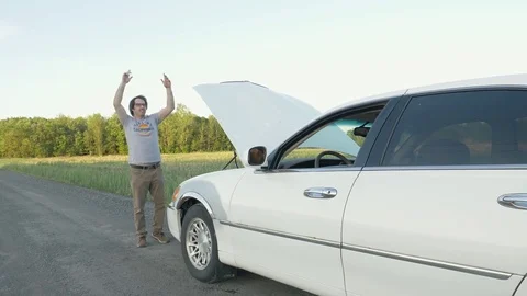 Man Calling For Help Making Signs With His Hand After His Car Broke Down On T Stock Footage 76749086