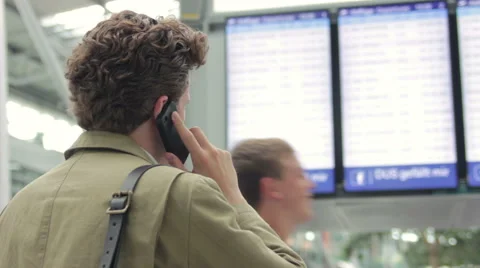 Man calling for information on his flight Stock Footage 40830526