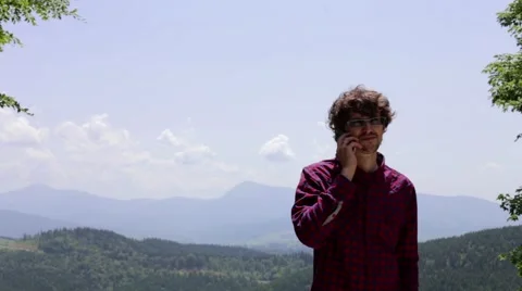 Man calling phone on the mountain Stock Footage 67807951