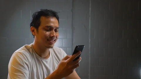  a man calling someone by his handphone. Video stock 105965895