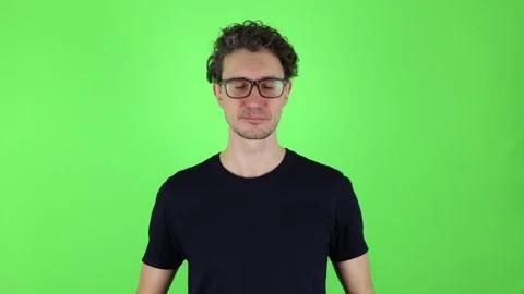 Man calm expression on face does breathing meditation practices to calm down Stock Footage 303143645