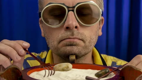 Man calms down using japanese mini rock garden. Stock Footage 134010717