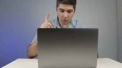 The man came up with an idea what to print on a laptop Stock Footage 169443077