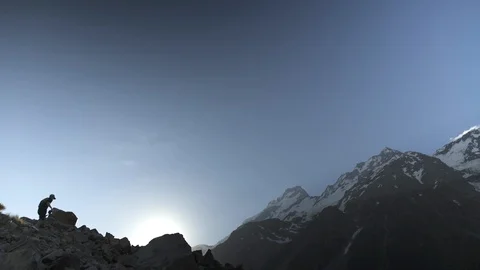 Man with camera climbing up the mountain Stock Footage 95127867