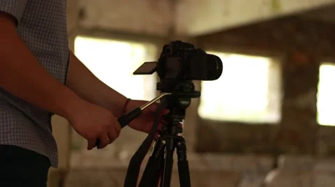 Man with camera in the destroyed building Stock Footage 62643561