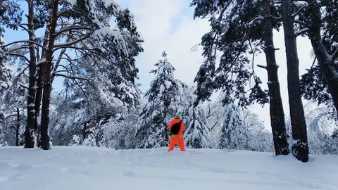 Man with camera making a photo of winter snowy forest. Stock Footage 86846886