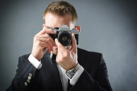 Man with camera Stock Photos