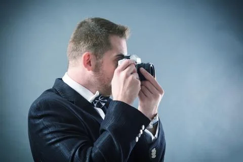 Man with camera Stock Photos
