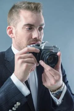 Man with camera Stock Photos