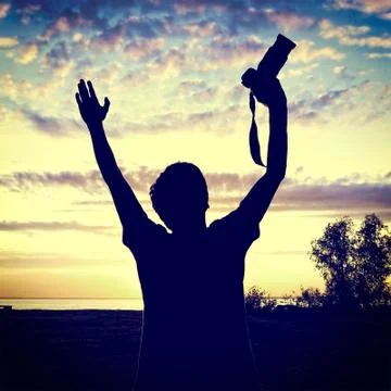 Man with a Camera at Sunset Foto stock