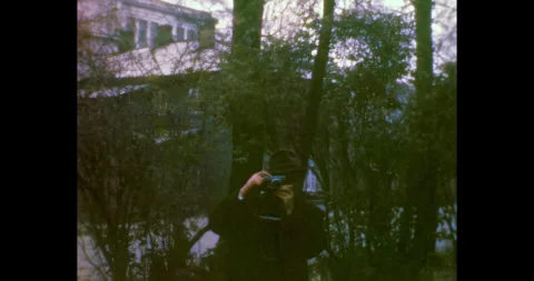 Man with camera takes picture. Unrecognizable Photographer Vidéo 303058747