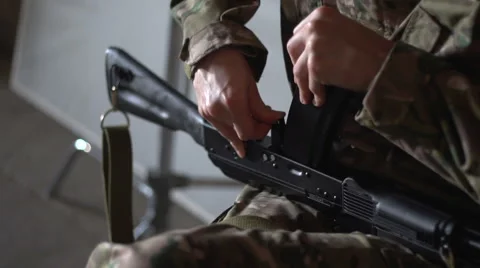 Man in camouflage inserts into the machine shop. Stock-Footage 60076934