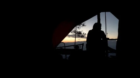 A man camping at moutain Stock Footage 120973715