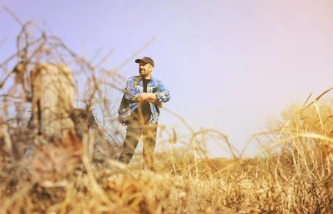 Man Camping at Sundown Stock Photos