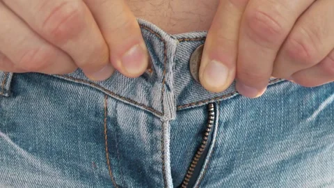 Man can not button his jeans at waist. Skinny jeans and fat belly Stockbeeldmateriaal 318418916