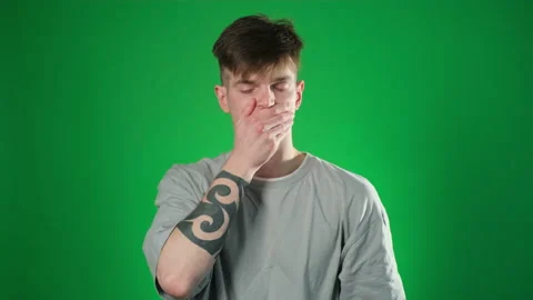 Man can not speak over green background Stock Footage 209132430