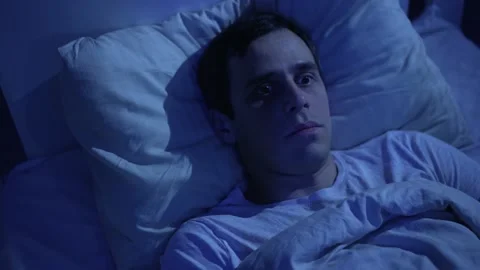 Man cannot fall asleep due to noisy neighbors Stock Footage