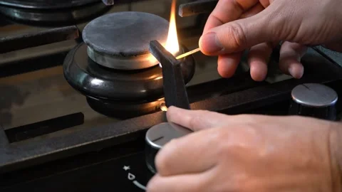 A man cannot light gas on a gas stove. No gas. Stock Footage 196291562