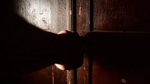Man cannot open the door of the old  cupboard Stock Footage 120602203
