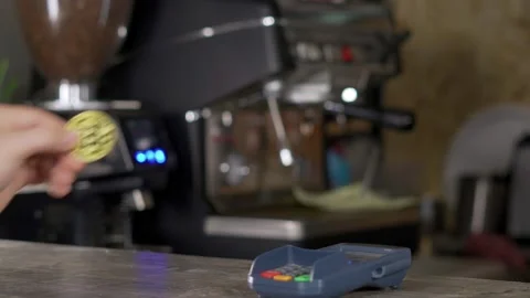 A man cannot pay with cryptocurrency in a coffee shop. Video stock 130849829