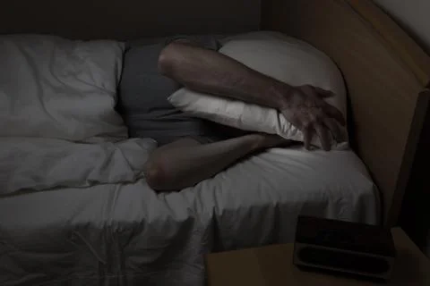 Man cannot sleep at night time Stock Photos