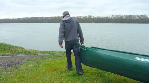 Man with Canoe at River 1 Stock Footage 2584895