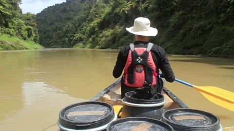 Man canoeing on a big river Stock Footage 50482511