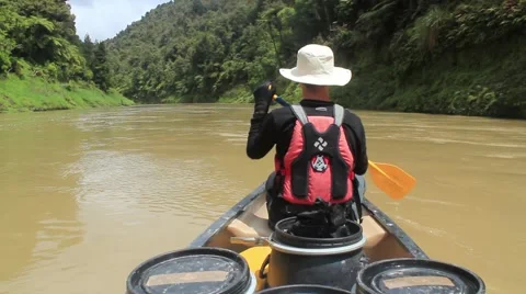 Man canoeing on a big river Stock Footage 50482646