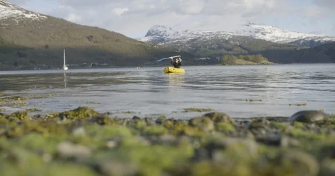 Man canoeing in the river Stock Footage 85835702