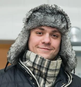 Man in a cap with earflaps Fotos Stock