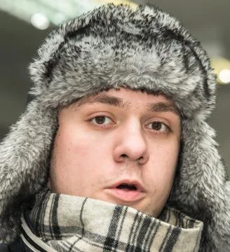 Man in a cap with earflaps Foto stock