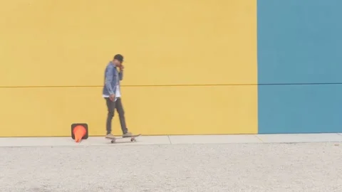 Man in cap rides skateboard 스톡 동영상 143486954