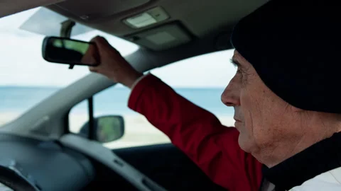 Man In The Car Adjusting The Mirror Stock Footage 275297070