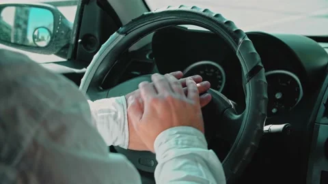 A man in a car with both hands presses hard on the sound signal. Stock Footage 150155403