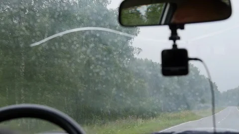 Man in the car is driving along the road Stock Footage 80149262
