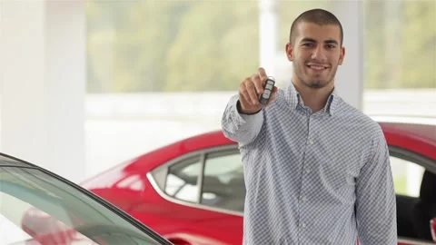 Man with car key outside Stock Footage 252682026
