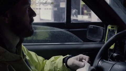 A man in a car taking order in auto fast food Stock Footage 73758144