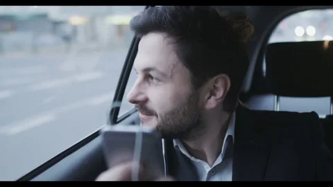 Man in a Car Talking on the Phone. The Car Stops Stock Footage 74497728